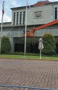 Parliament House exterior façade-cleaning setup with a boom lift, supplied Prope project image